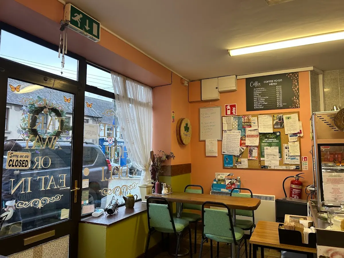 Interior seating area with community notice board and Coffee to Go menu